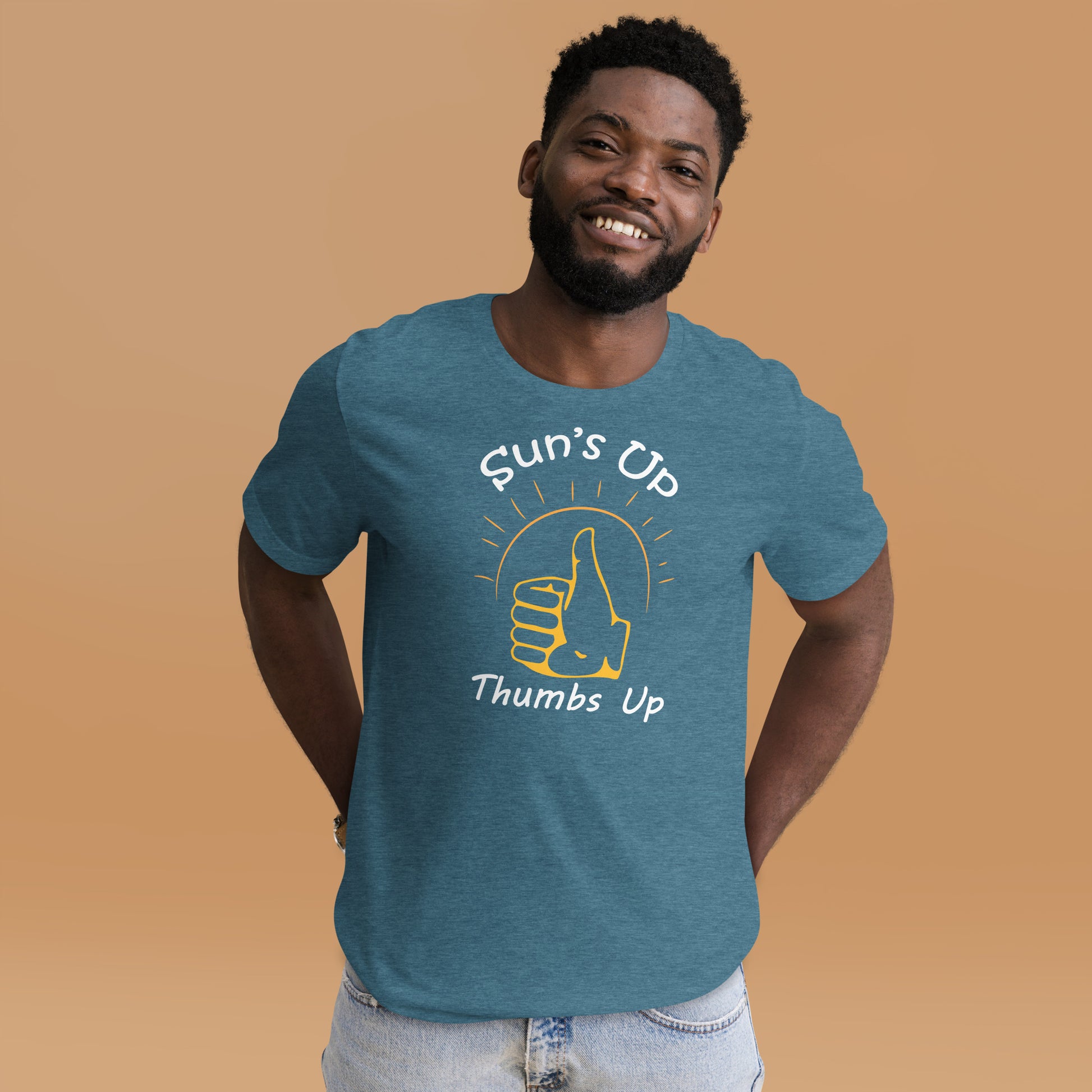 Man wearing a heather teal graphic tee with a thumbs up and the caption "suns up, thumbs up"